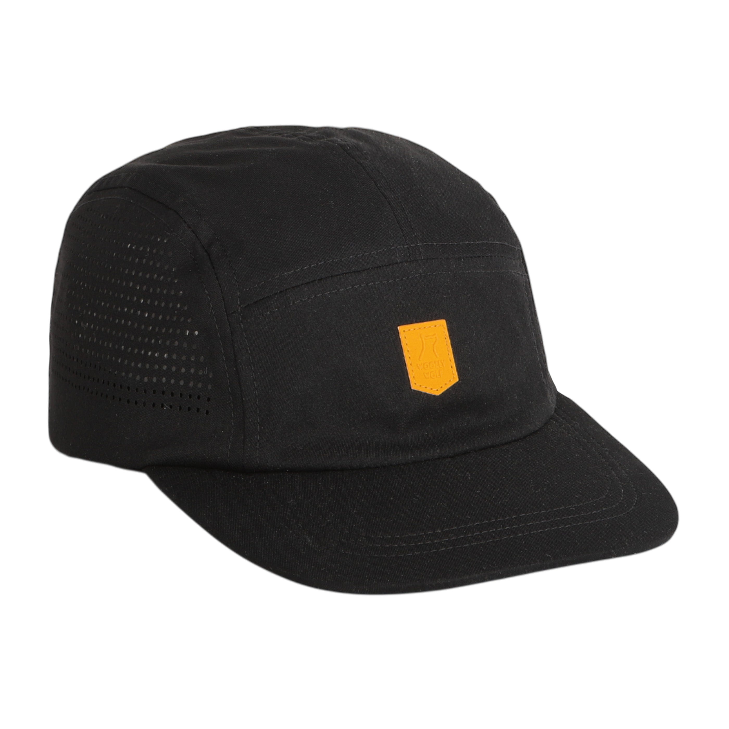 The Alpha 360 Tech Cap Black is a five-panel black cap with a curved brim, featuring a small yellow rectangular patch on the front and ventilation holes on the side panels.