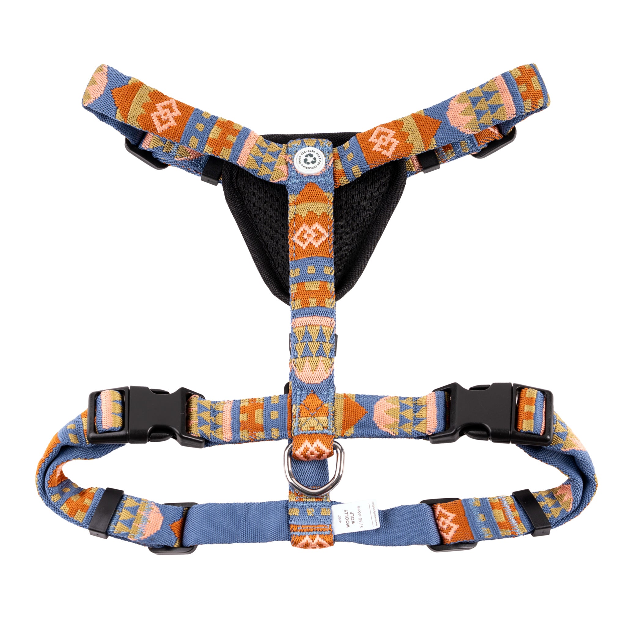 Colorful patterned dog harness with black buckles, a mesh chest pad, and a metal ring for leash attachment.