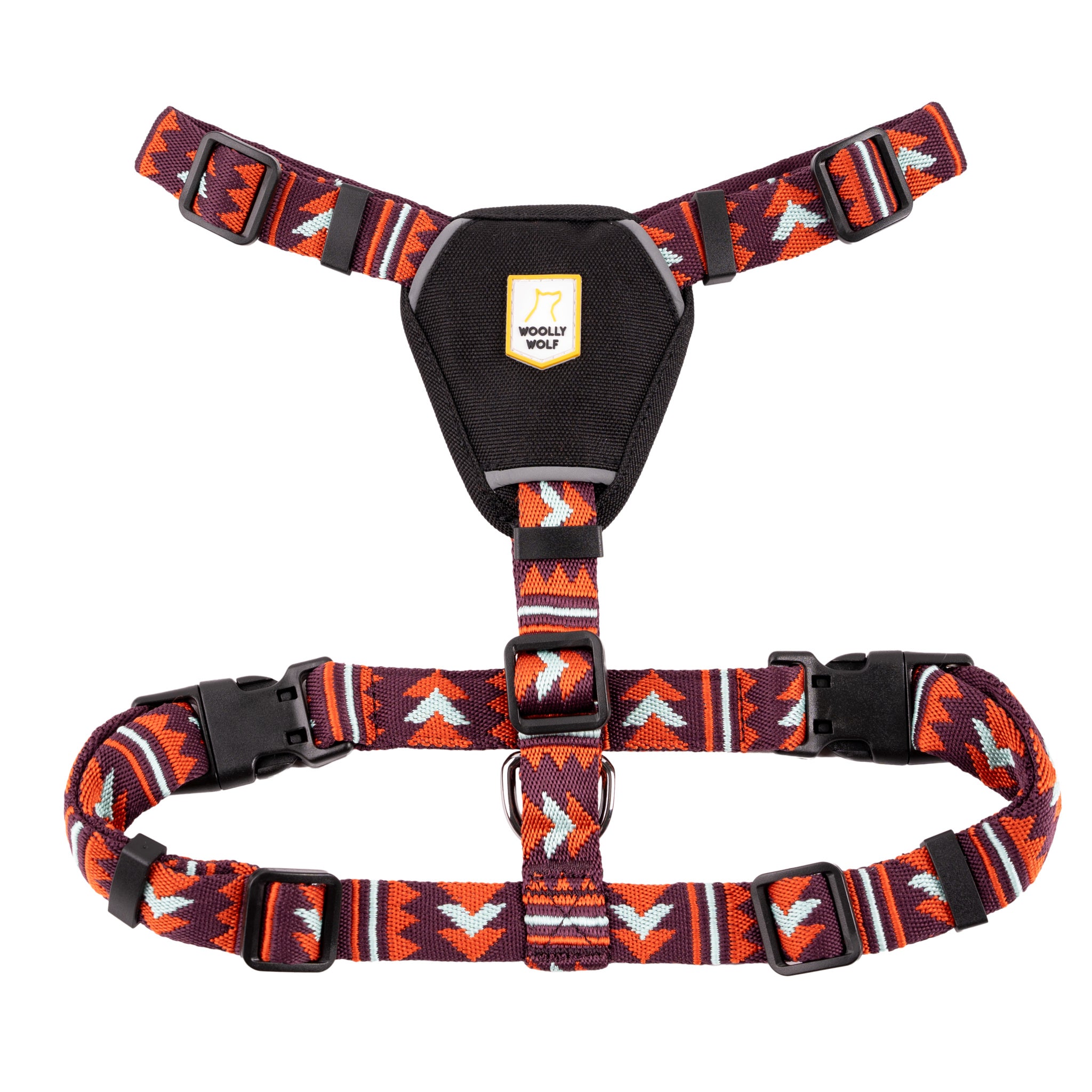 Red and black patterned dog harness with adjustable straps and a black chest pad displaying the Woolly Wolf logo.