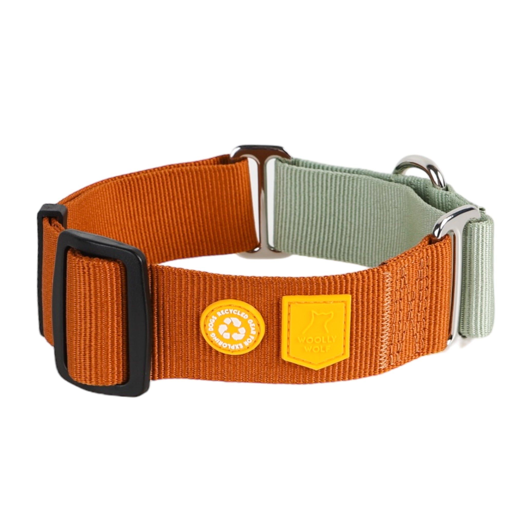 The Color Block Martingale Dog Collar Terracotta Mix features orange and light gray webbing, black and silver hardware, plus two small badge-style patches: one with a recycling symbol and one with brand text and a dog’s head outline.