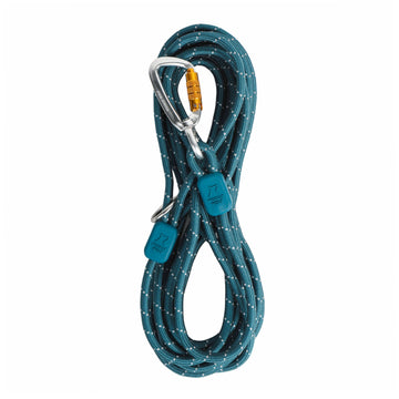 The Long Rope Dog Leash Deep Teal is coiled neatly, secured with two matching straps, and attached to a silver carabiner with an orange lock.