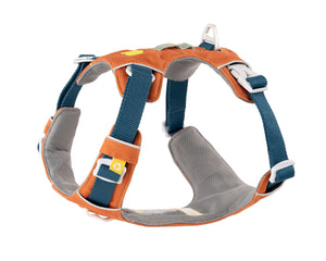 Orange and gray dog harness with blue adjustable straps and white plastic buckles, featuring a handle and a small yellow paw print tag. The harness is padded for comfort and designed for secure fit.