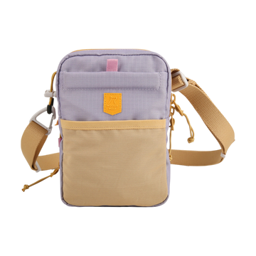 Small crossbody bag with a beige front pocket, lilac body, and adjustable tan strap, on a white background.