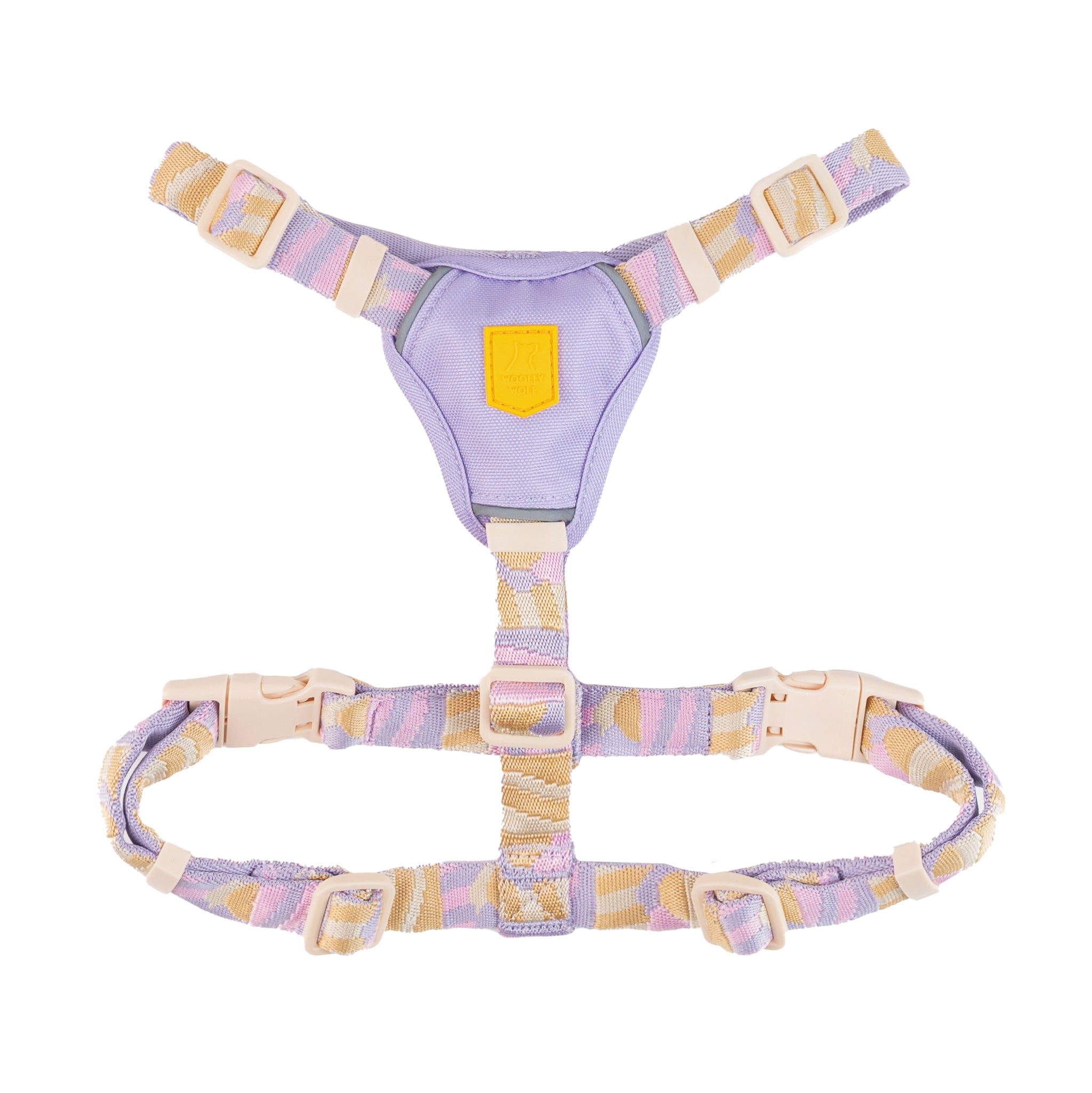 Pastel-colored adjustable pet harness with beige, purple, and pink straps and plastic buckles, laid flat on white.