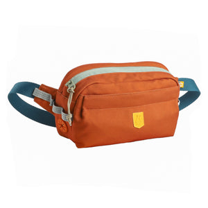 The Alpha 360 Hip Pack Terracotta Mix features an orange design with a blue adjustable strap, light gray zipper, and a small yellow front patch, shown on a white background.