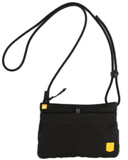 A small black crossbody bag with a thin strap and yellow accents on the front.